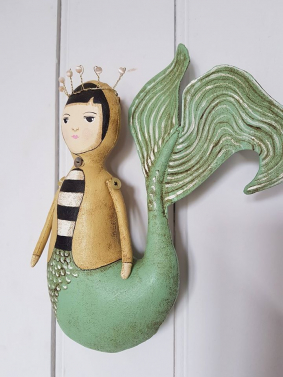 mermaid in yellow jacket.