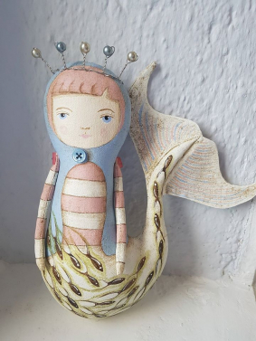Mermaid with blue jacket.